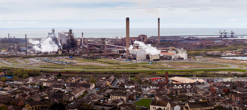 Factory Tata Steel with smoking chimneys on a sunny day, IJmuiden, The  Netherlands Stock Photo