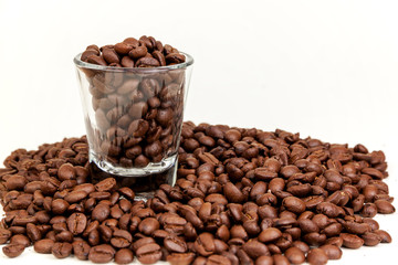 short glass with coffee beans