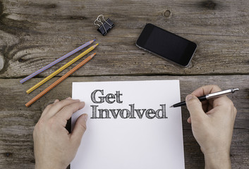 Get Involved. Text on a sheet of paper.