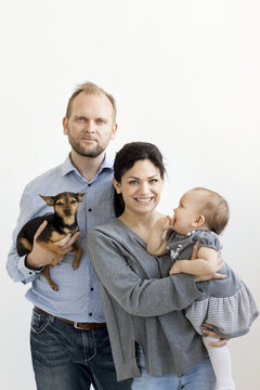 Parents with baby girl and dog