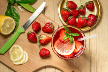 Glass of freshness lemonade with strawberries and mint , on the
