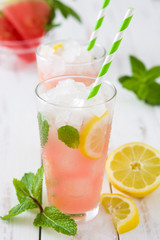 Fresh watermelon mojito on white wooden table
