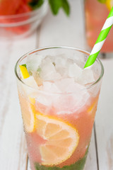 Fresh watermelon mojito on white wooden table
