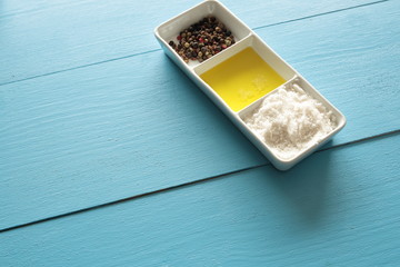 Container with salt, oil and pepper