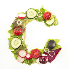Letter C made of salad