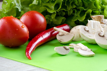 Vegetables and mushrooms on the kitchen blackboard