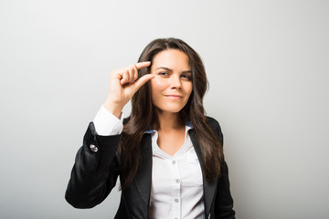 Fototapeta premium young woman showing a little