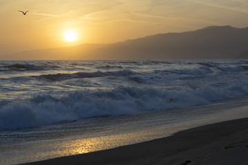 The Pacific ocean during sunset. Landscape with blue sea, the mountains and the dusk sky, the USA, Santa Monica. 