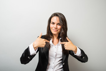 woman pointing at herself