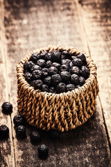 Fototapeta na wymiar berries in basket on wooden vintage table,healthy food.