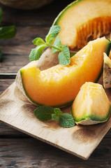 Sweet orange melon on the wooden table
