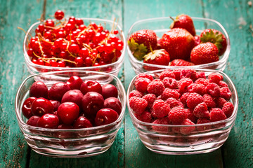 Fresh summer berries , wooden background, healthy food.