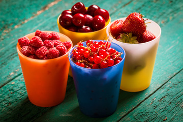 Fresh summer berries , wooden background, healthy food.