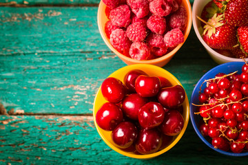 Fresh summer berries , wooden background, healthy food.