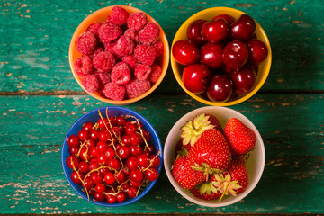 Fresh summer berries , wooden background, healthy food.