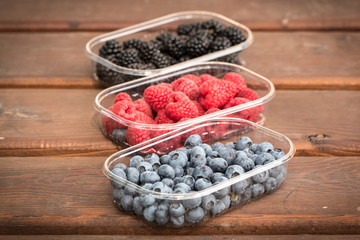 Fresh summer berries , wooden background, healthy food.