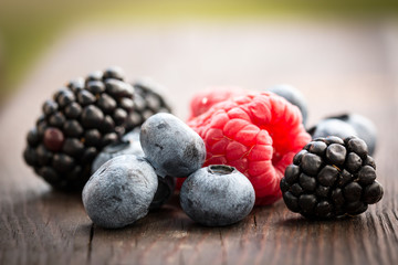 Fresh summer berries , wooden background, healthy food.