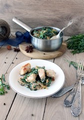 chicken in a creamy sauce with spinach and tarragon