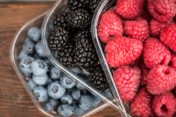 Fresh summer berries , wooden background, healthy food.