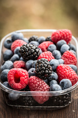 Fresh summer berries , wooden background, healthy food.