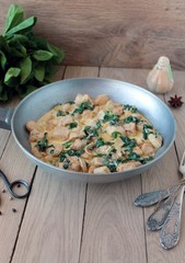 chicken in a creamy sauce with spinach and tarragon