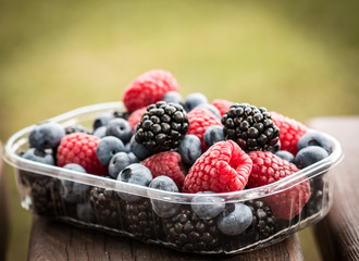 Fresh summer berries , wooden background, healthy food.