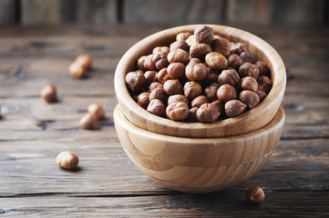 Raw hazelnut on the wooden table