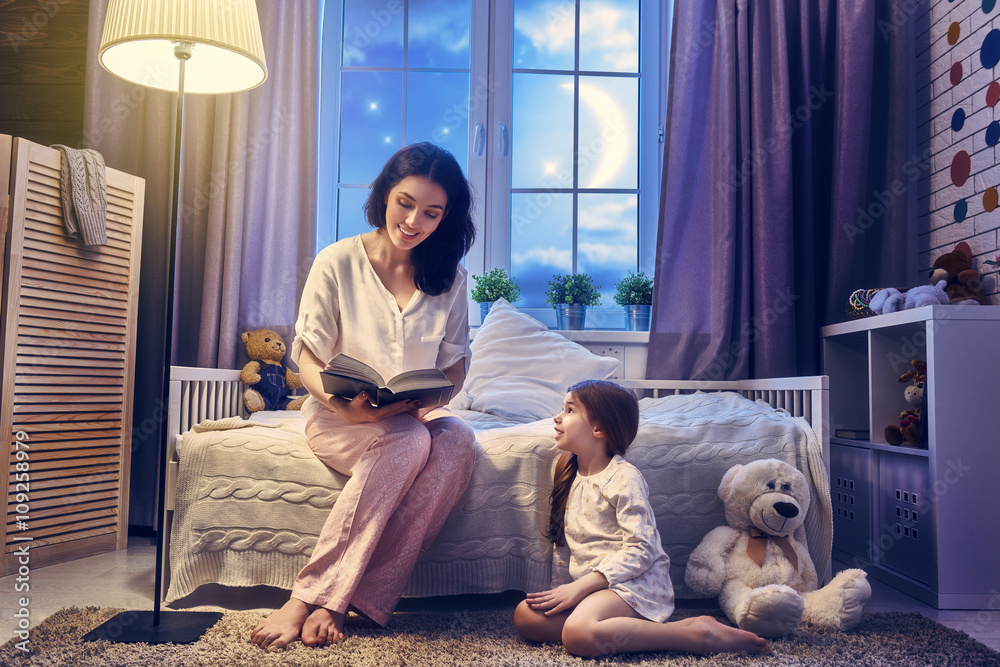 Wall mural mother reading a book