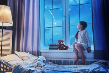 girl sitting at the window