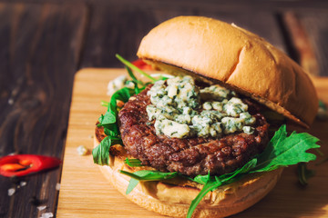 Fresh burger with blue cheese and arugula