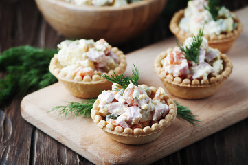 Traditional russian salad Olivier served in tartlet