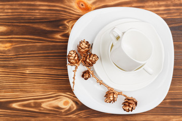 White dishware with gold dried decorations