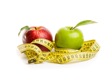 Apples, flowers and measuring tape. 