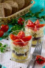 Salad with meat and vegetables on a wooden table, selective focu