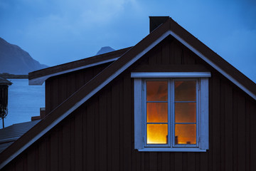 Illuminated window at dusk