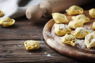 Italian traditional tortellini on the wooden table