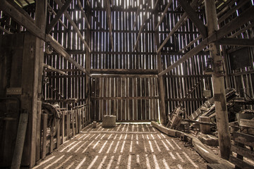 Morning Light. Morning sunlight illuminates the interior of a barn. This is a barn open to the public on public park lands, it is not a privately owned property. - obrazy, fototapety, plakaty