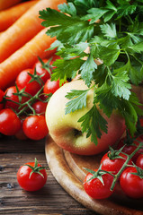 Concept of vegan food with tomato and apple