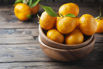 Sweet orange mandarin on the wooden table