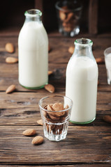 Healthy Almond milk on the wooden table