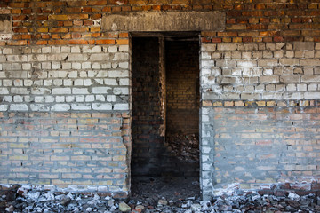Door aperture inside the old ruined brick building