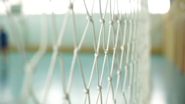 Volleyball net close-up.