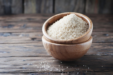 Brown sugar on the wooden table