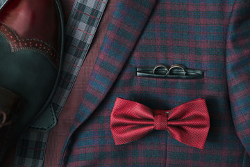 Men burgundy suit, bow tie and vintage leather shoes