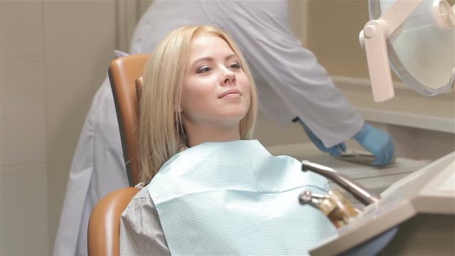Woman receive checkup at the dentist