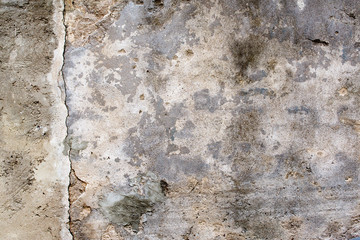 old wall with damaged grey plaster - background 2