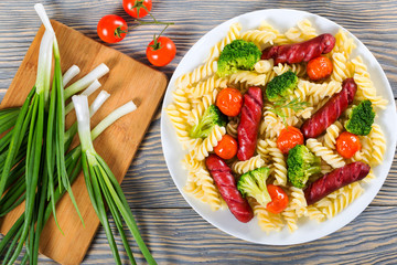 Pasta salad with  broccoli and grilled sausages