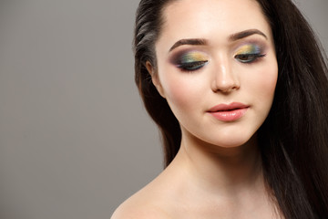 Fototapeta premium Portrait close up of young beautiful woman in studio