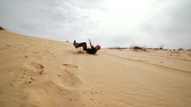 Family spending time together and having fun in Oleshky sands.Ukraine. Slow motion
