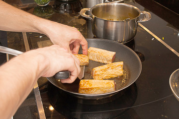 cook cut with knife slices of medium rare grilled tuna meat